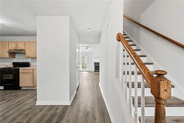 a view of a kitchen cabinets and wooden floor