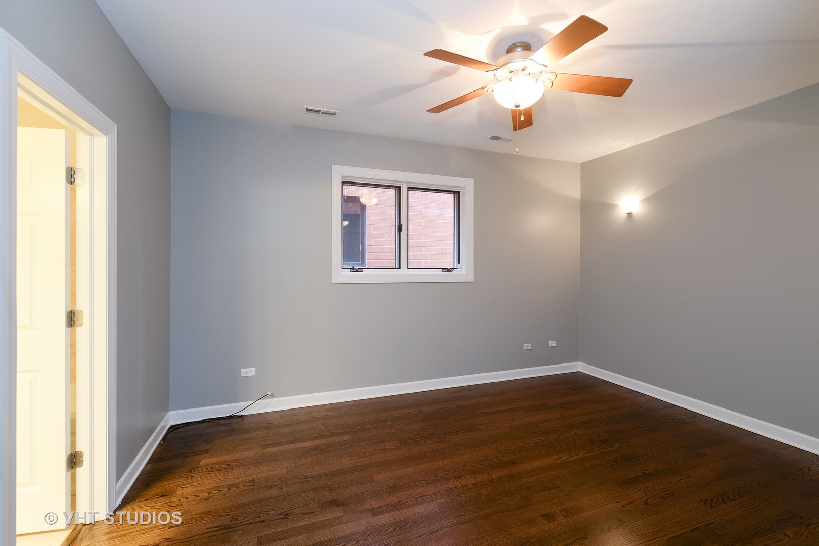 514 South Denvir Avenue, Unit 2 Chicago, IL 60612 - Photo 7 of 13 wooden floor in an empty room with a window