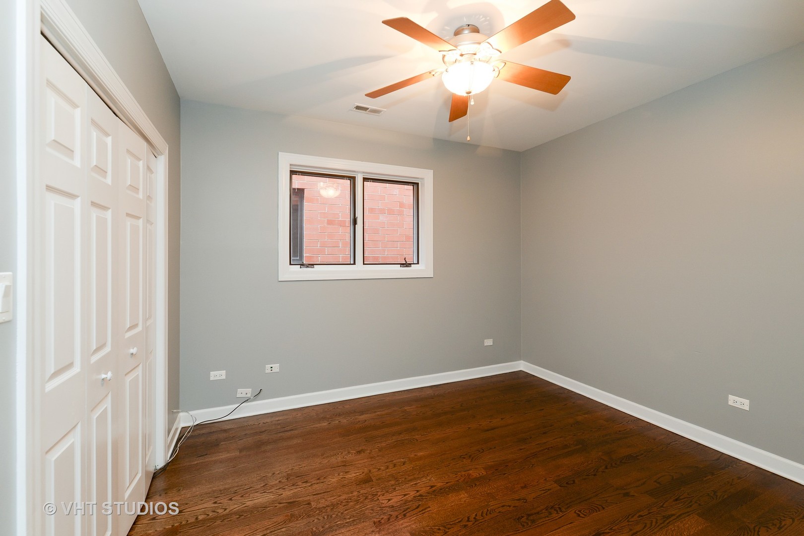 514 South Denvir Avenue, Unit 2 Chicago, IL 60612 - Photo 10 of 13 an empty room with a window and a fan