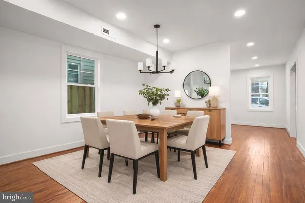 a view of a dining room with furniture window and wooden floor