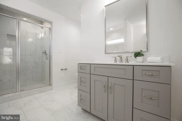a spacious bathroom with a bathtub and a shower