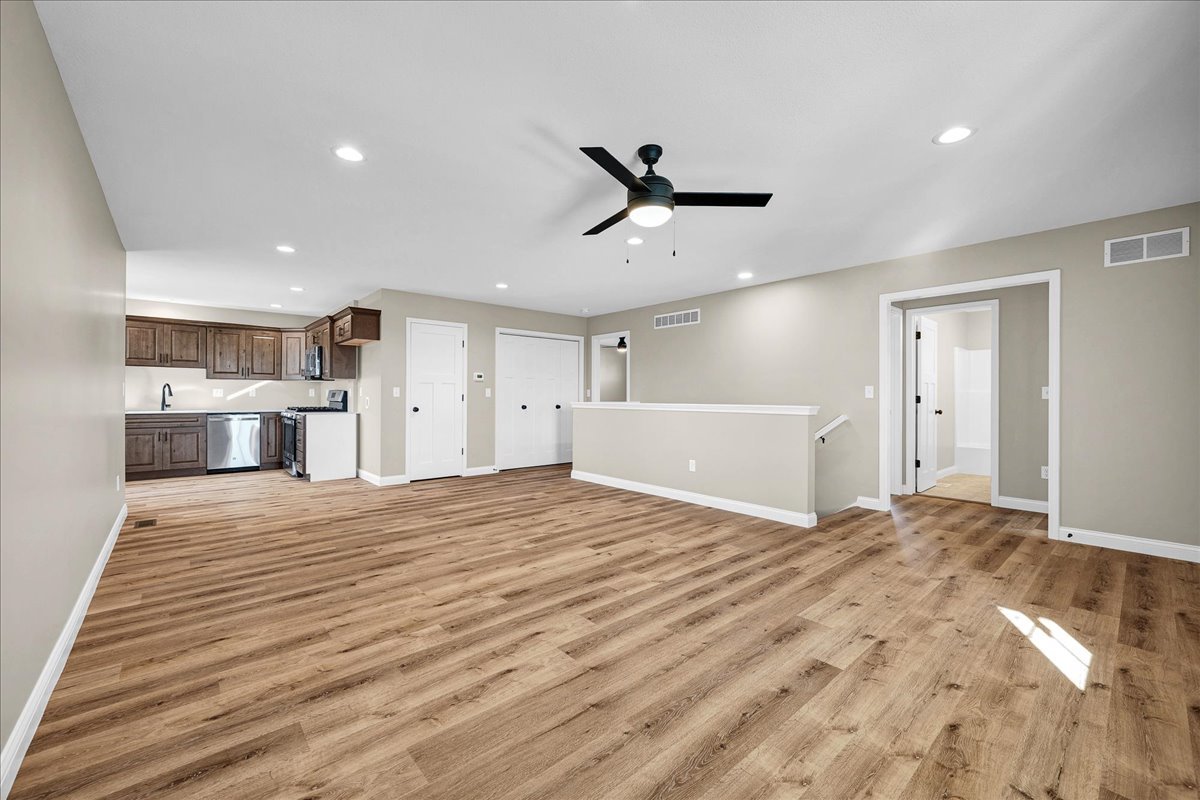 180 South Oak Street El Paso, IL 61738 - Photo 6 of 32 a large bedroom with a bed and a chandelier