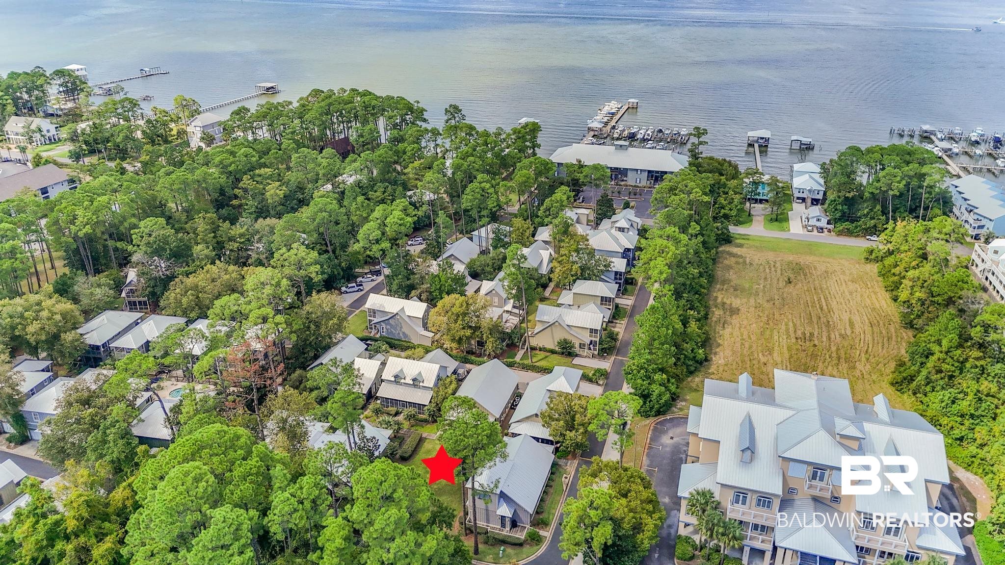 25773 Canal Road Orange Beach, AL 36561 - Photo 10 of 32 Aerial perspective of suburban area with a nearby body of water
