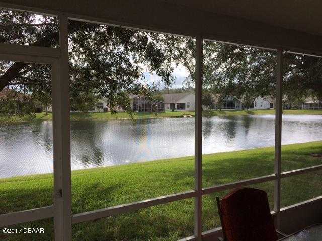 812 Star Reef Lane Edgewater, FL 32132 - Photo 2 of 17 a view of a lake from a balcony