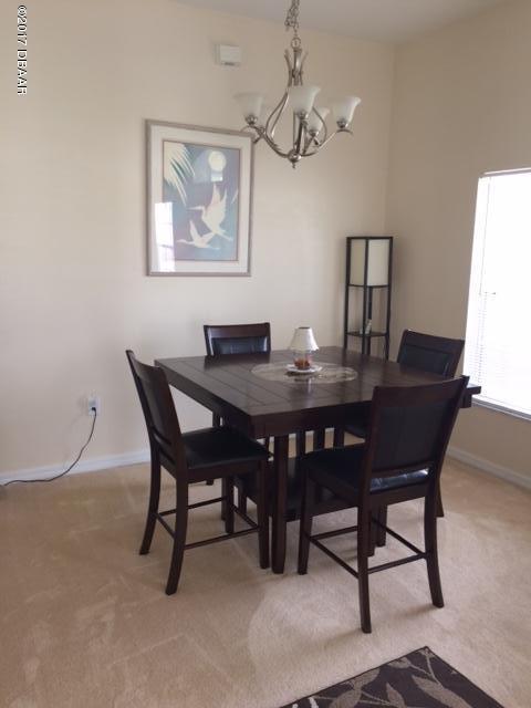 812 Star Reef Lane Edgewater, FL 32132 - Photo 6 of 17 a view of a dining room with a table and chairs