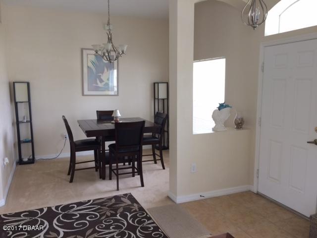 812 Star Reef Lane Edgewater, FL 32132 - Photo 8 of 17 a view of a dining room with furniture