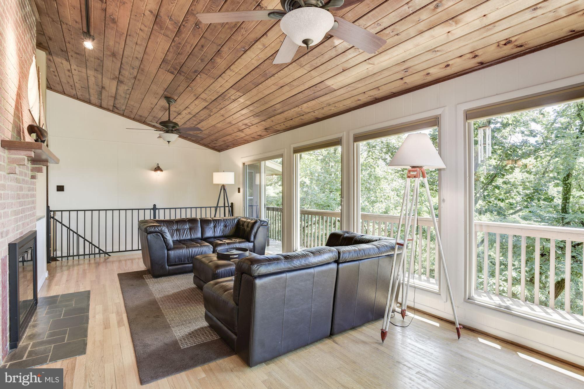 1607 Riverside Drive Annapolis, MD 21409 - Photo 9 of 30 Vaulted Living Room with Gathering Fireplace