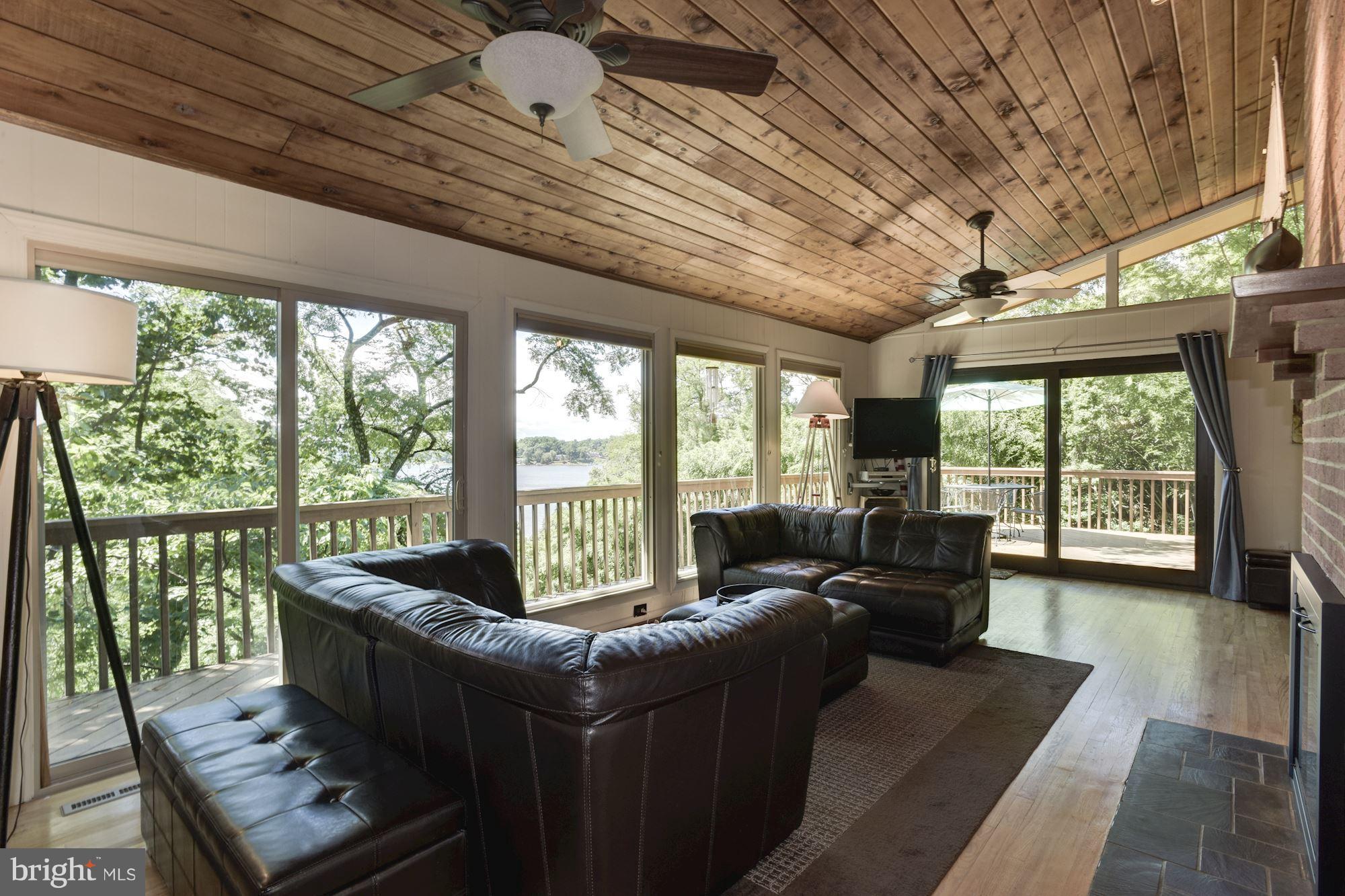 1607 Riverside Drive Annapolis, MD 21409 - Photo 10 of 30 Wall of Windows and Access to Lounging/Dining Deck