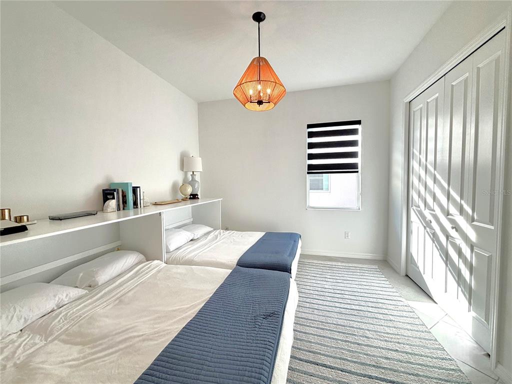 17510 Jadestone Court Venice, FL 34293 - Photo 19 of 46 a bedroom with a bed and a window