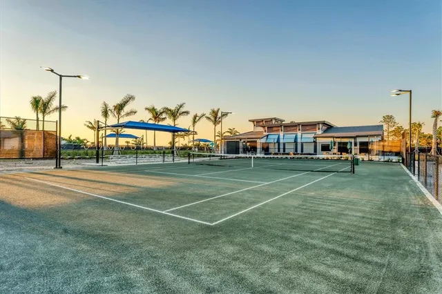 a view of an outdoor space and basketball court