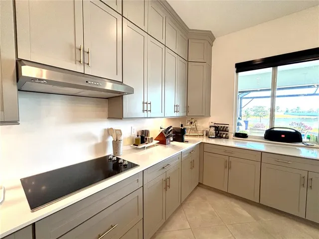 a kitchen with a sink and cabinets