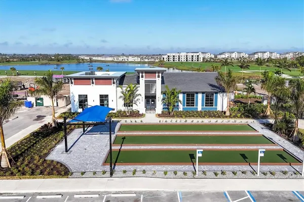 an aerial view of a house with swimming pool and outdoor space