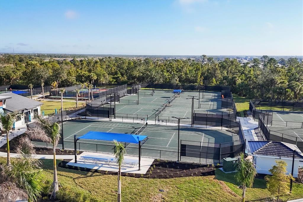 17510 Jadestone Court Venice, FL 34293 - Photo 44 of 46 a view of a swimming pool with seating area and hardwood floor