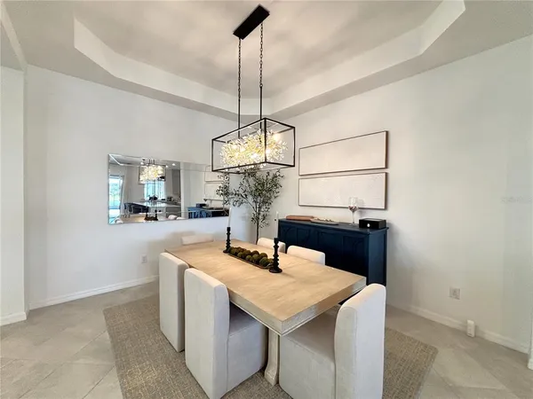 a kitchen with a sink a counter space and cabinets