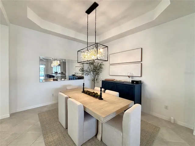 a kitchen with a sink a counter space and cabinets