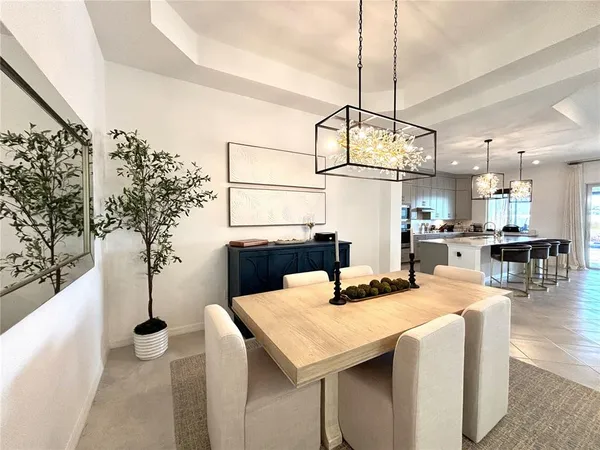 a kitchen with a table and chairs