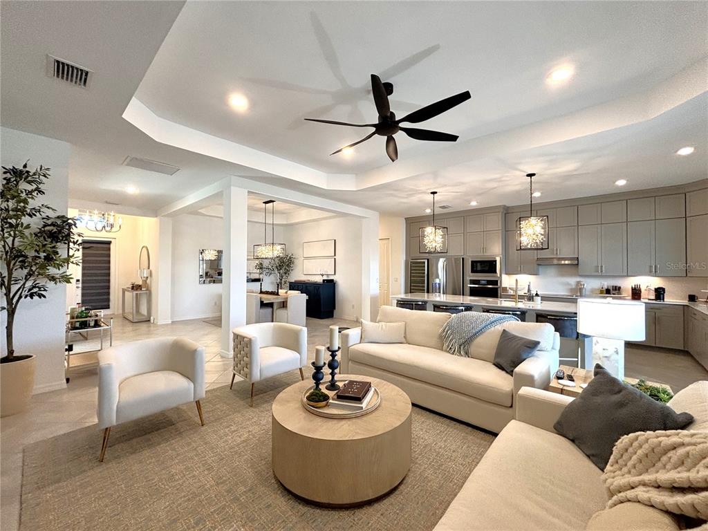 17510 Jadestone Court Venice, FL 34293 - Photo 9 of 46 a living room with furniture and a large window