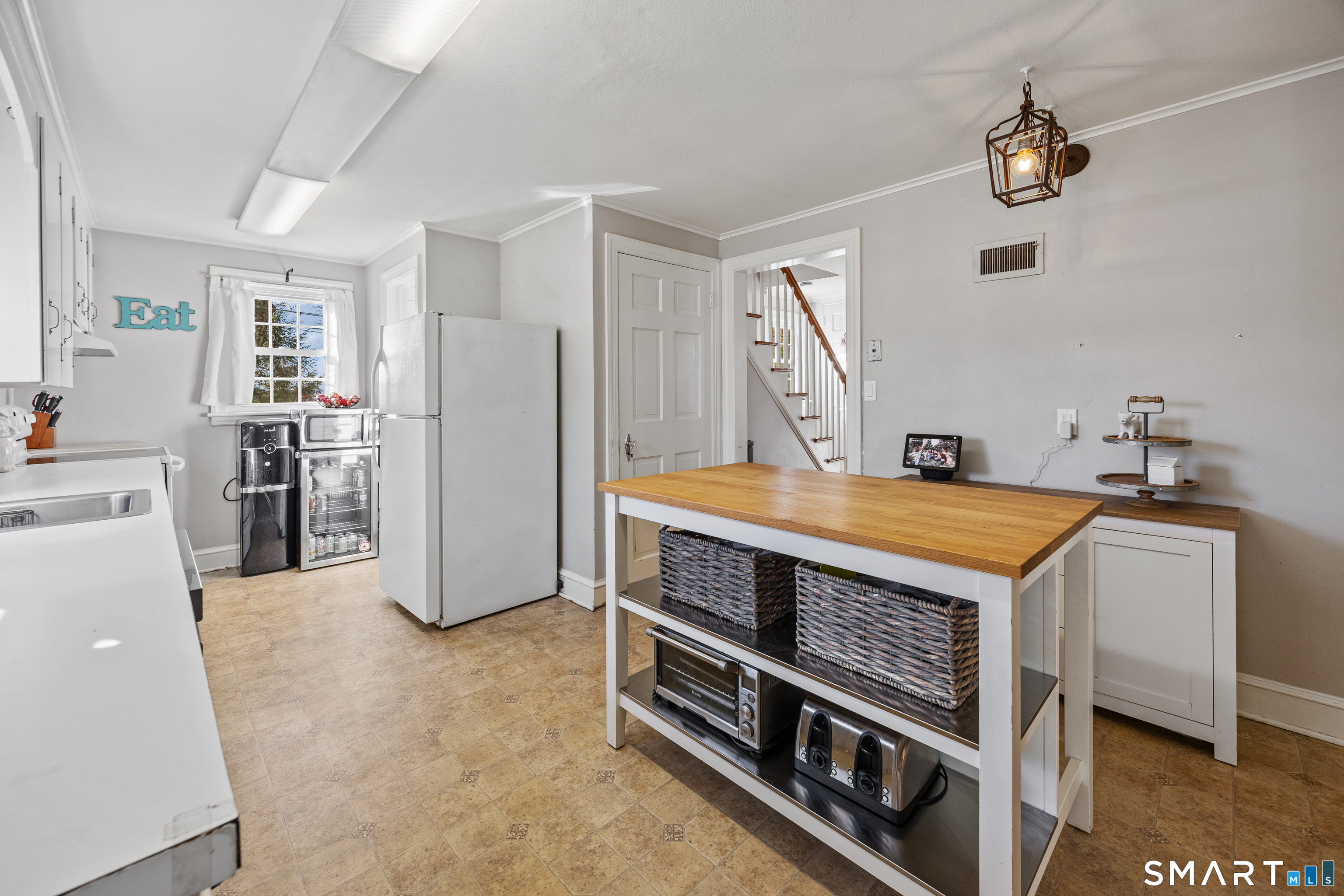 232 High Street Thomaston, CT 06787 - Photo 7 of 31 a kitchen with stainless steel appliances a stove and a refrigerator