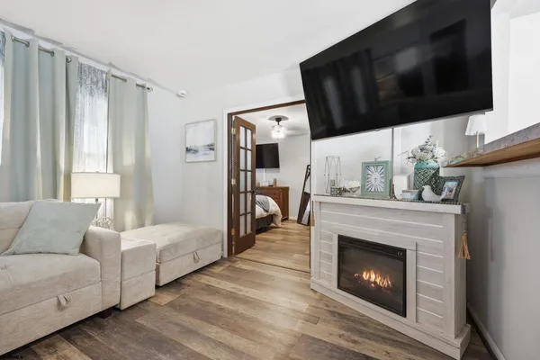 a living room with furniture and a fireplace