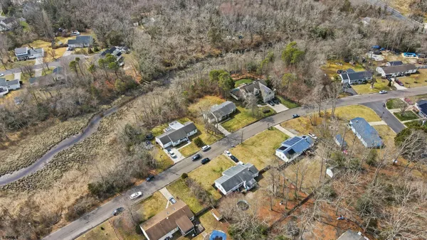 an aerial view of house with yard