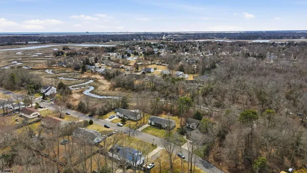 aerial view of a house with a yard