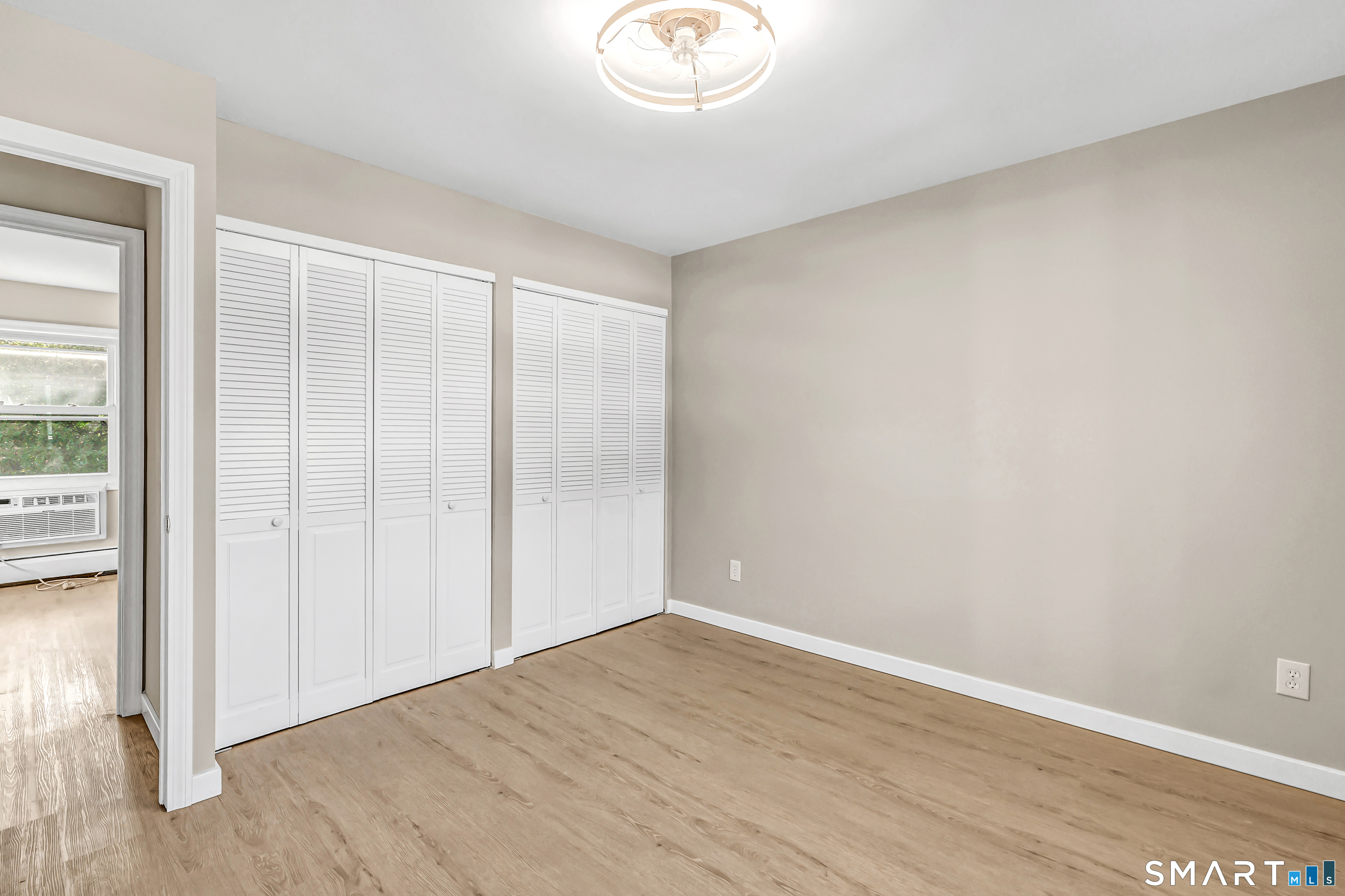 77 Meadow Lark Road Naugatuck, CT 06770 - Photo 20 of 40 Main Floor - Bedroom, vinyl flooring, wall unit for cooling, closets