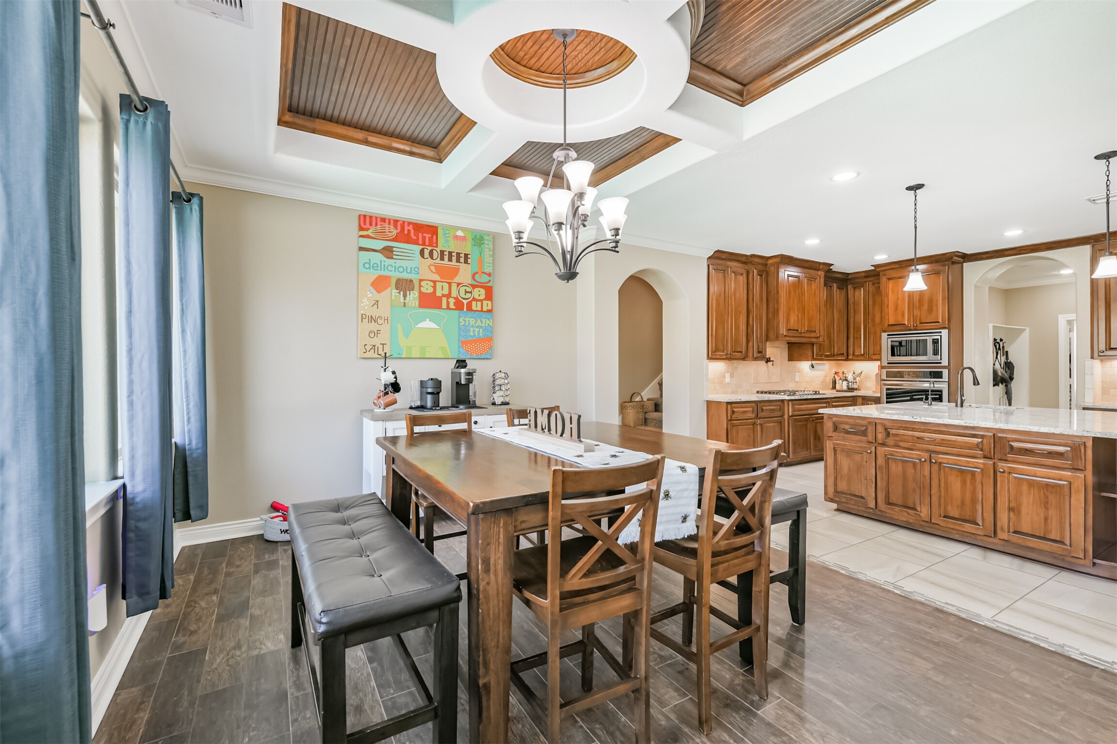 27553 Rio Blanco Drive Splendora, TX 77372 - Photo 11 of 41 a view of a dining room with furniture and chandelier