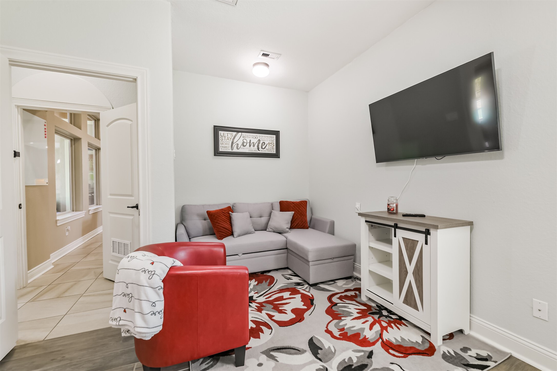 27553 Rio Blanco Drive Splendora, TX 77372 - Photo 16 of 41 a living room with furniture and a flat screen tv