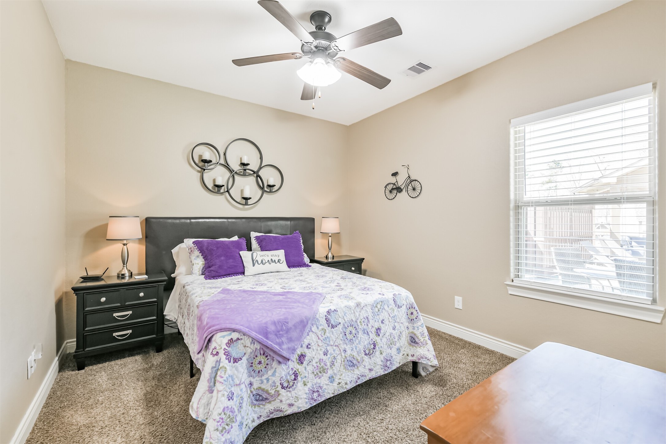 27553 Rio Blanco Drive Splendora, TX 77372 - Photo 20 of 41 a bedroom with a bed and a chandelier