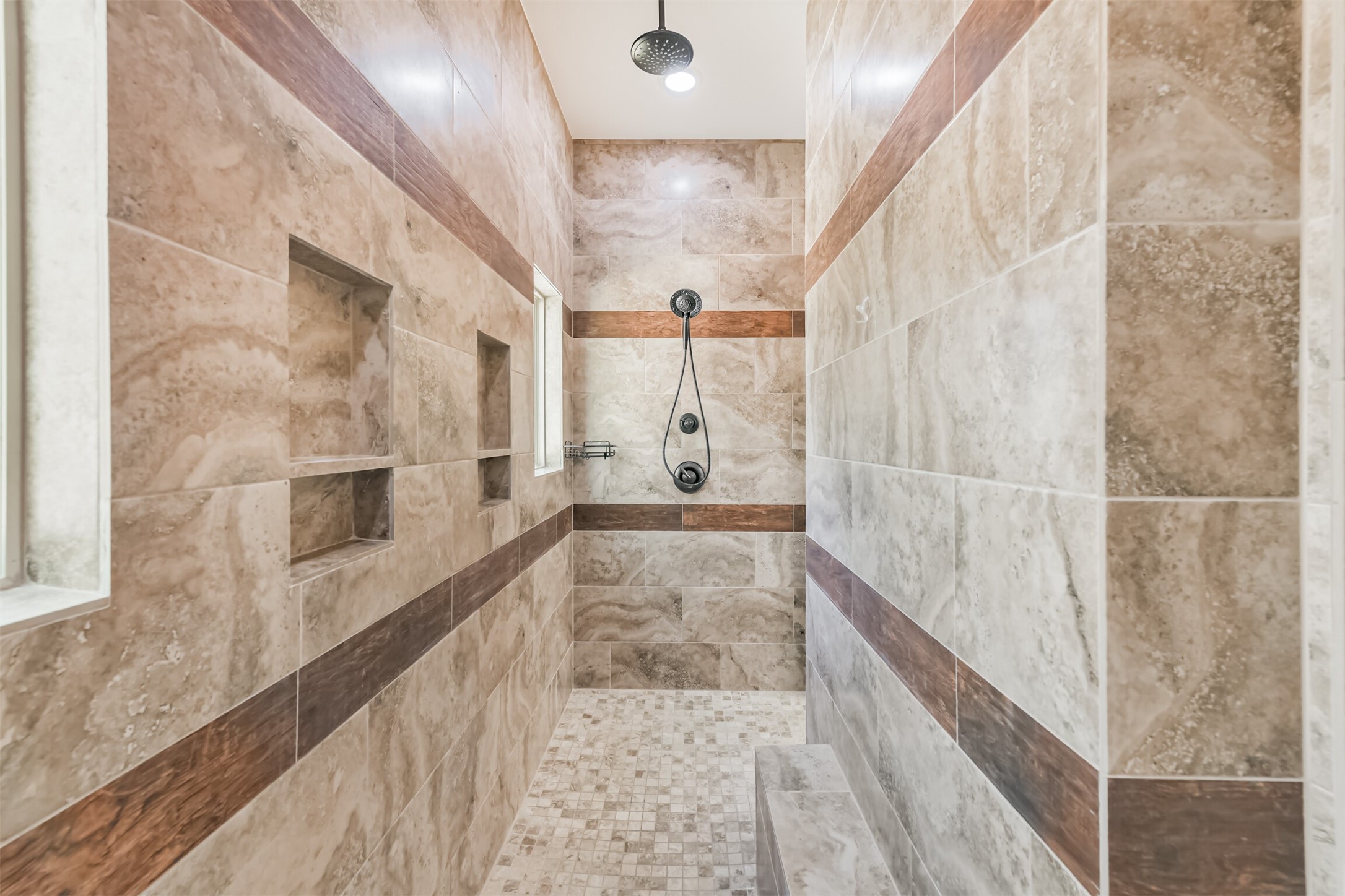27553 Rio Blanco Drive Splendora, TX 77372 - Photo 28 of 41 a bathroom with a glass shower door and mirror
