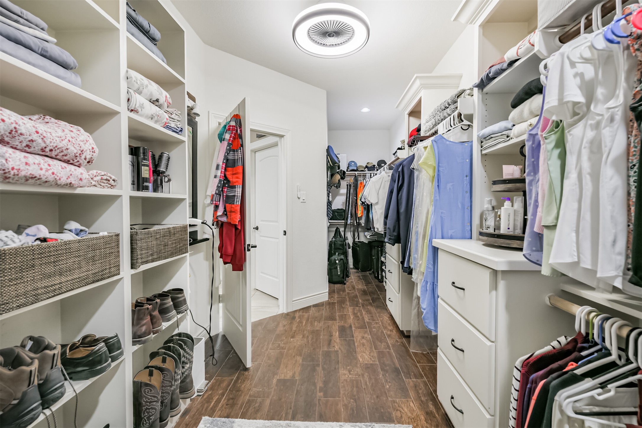27553 Rio Blanco Drive Splendora, TX 77372 - Photo 29 of 41 a view of walk in closet with clothes and shoes