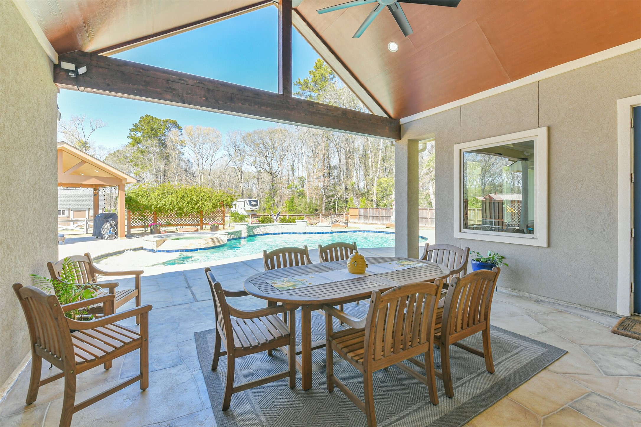 27553 Rio Blanco Drive Splendora, TX 77372 - Photo 30 of 41 a view of a dining room with furniture large windows and wooden floor