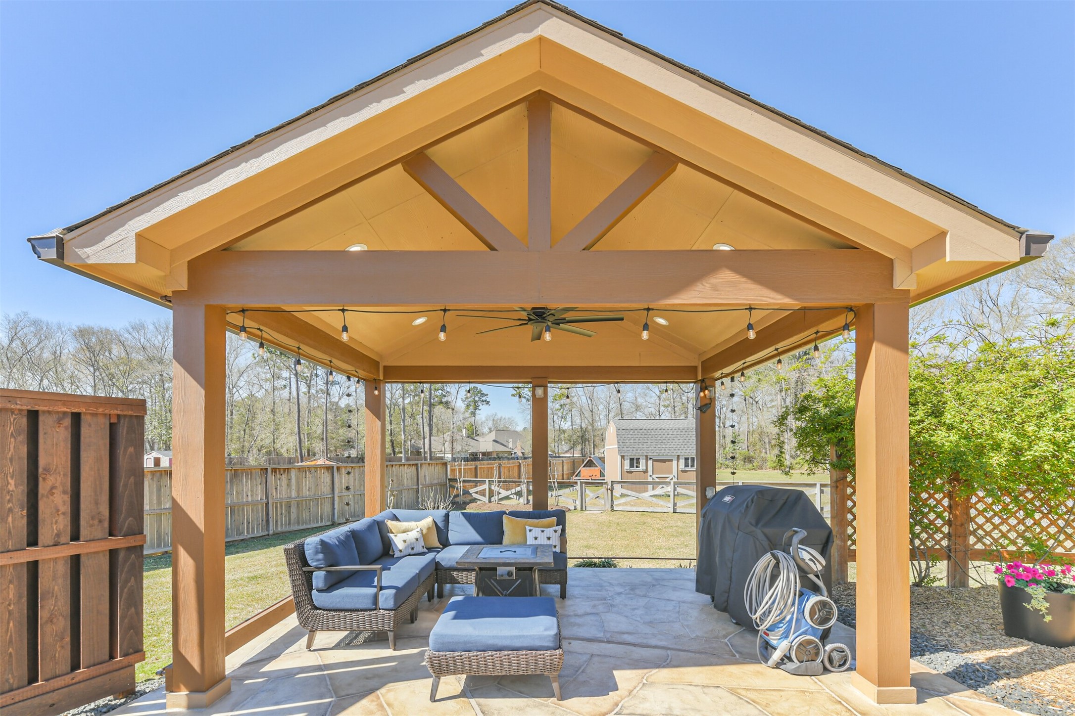 27553 Rio Blanco Drive Splendora, TX 77372 - Photo 33 of 41 a patio with yard glass top table and chairs