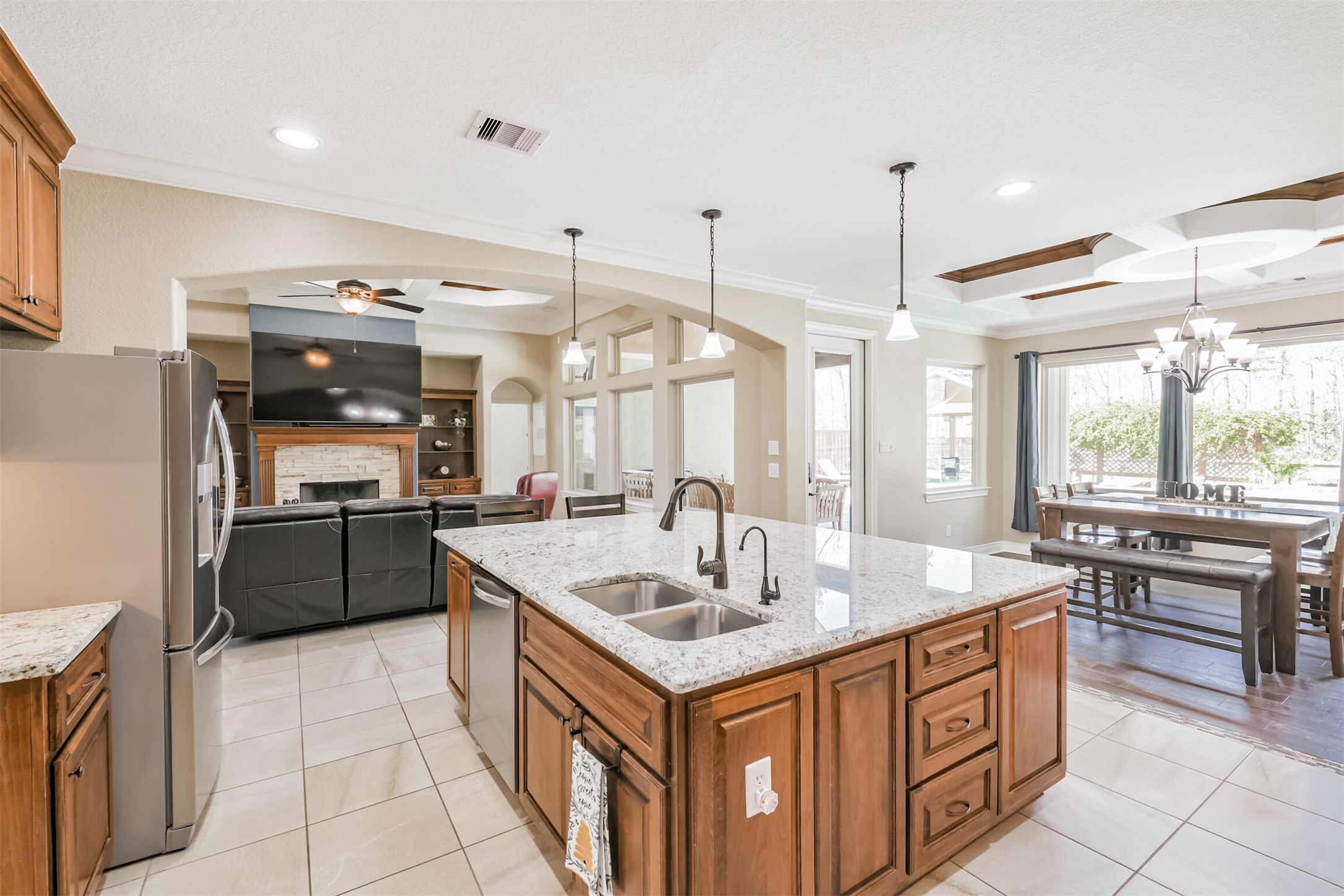 27553 Rio Blanco Drive Splendora, TX 77372 - Photo 9 of 41 a kitchen with stainless steel appliances granite countertop a sink and a refrigerator