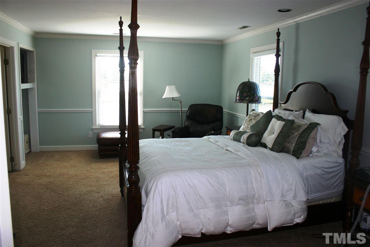307 Bacon Road Rougemont, NC 27572 - Photo 15 of 25 a bed room with two bed and a night stand
