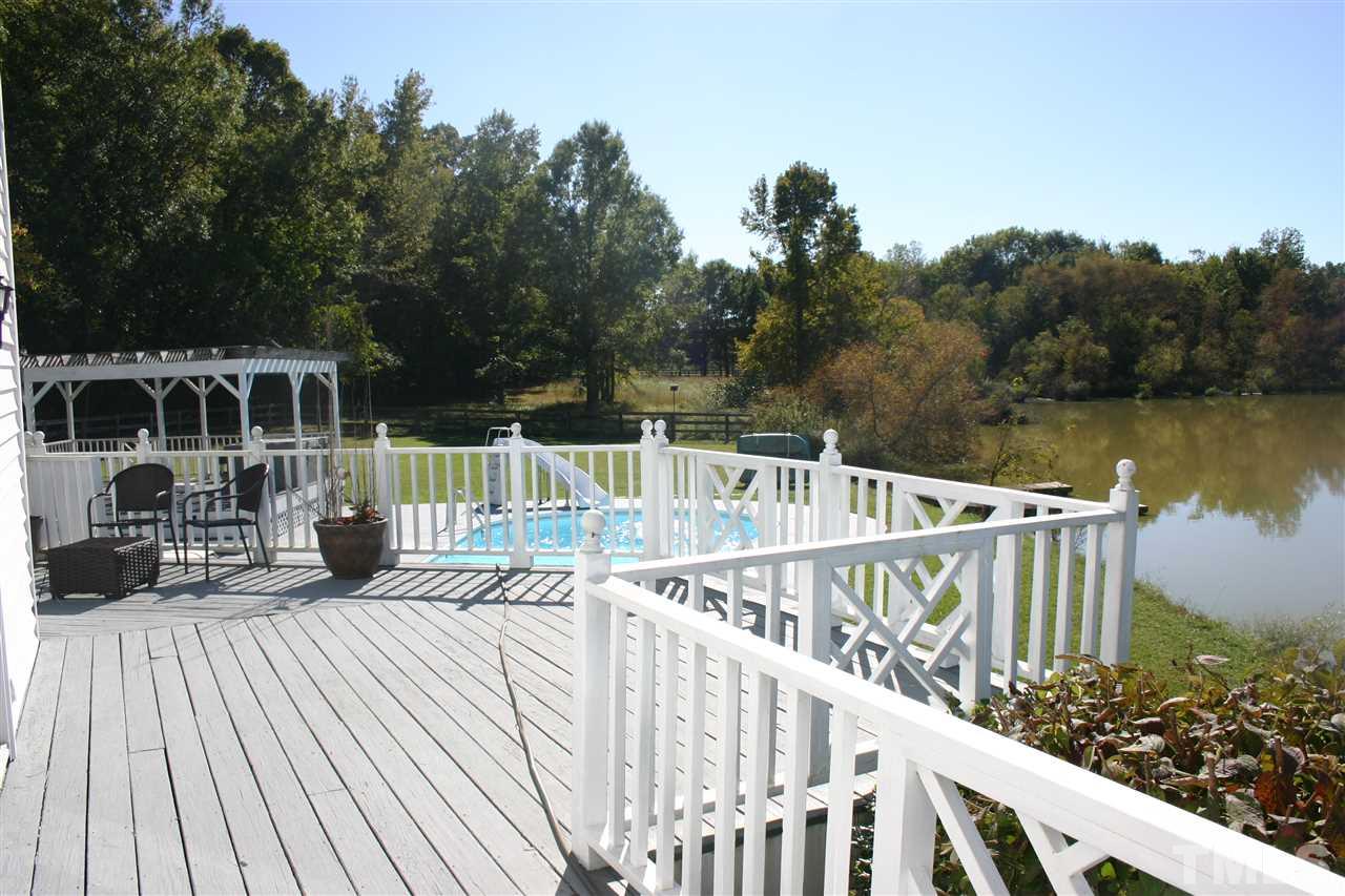 307 Bacon Road Rougemont, NC 27572 - Photo 19 of 25 a view of balcony with wooden floor and seating space