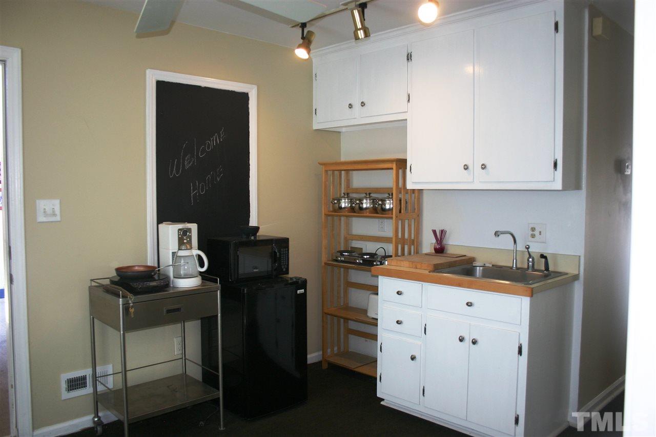 307 Bacon Road Rougemont, NC 27572 - Photo 24 of 25 a kitchen with a cabinets and chairs