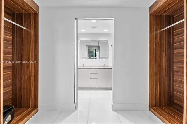 a view of a bathroom with a sink and mirror