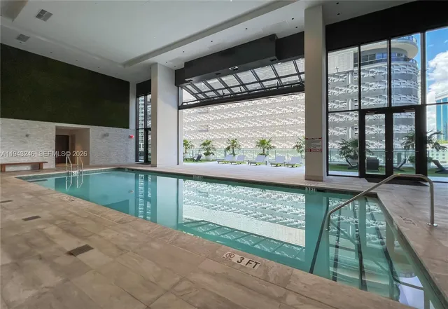 a view of swimming pool from a balcony