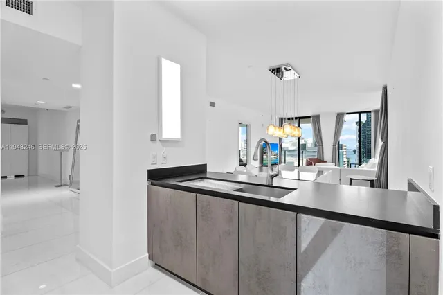 a bathroom with a sink and mirror
