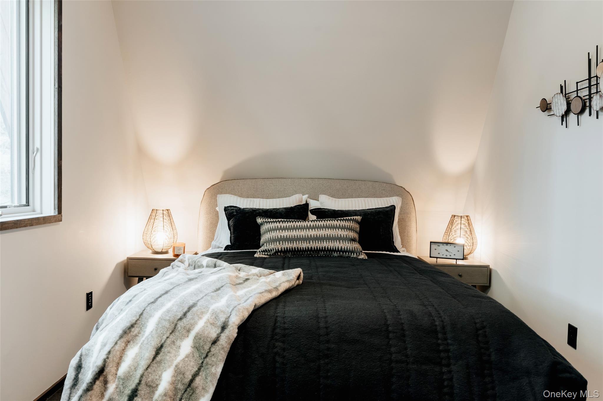 521 Perry Road Swan Lake, NY 12783 - Photo 19 of 32 a bedroom with a bed and a lamp