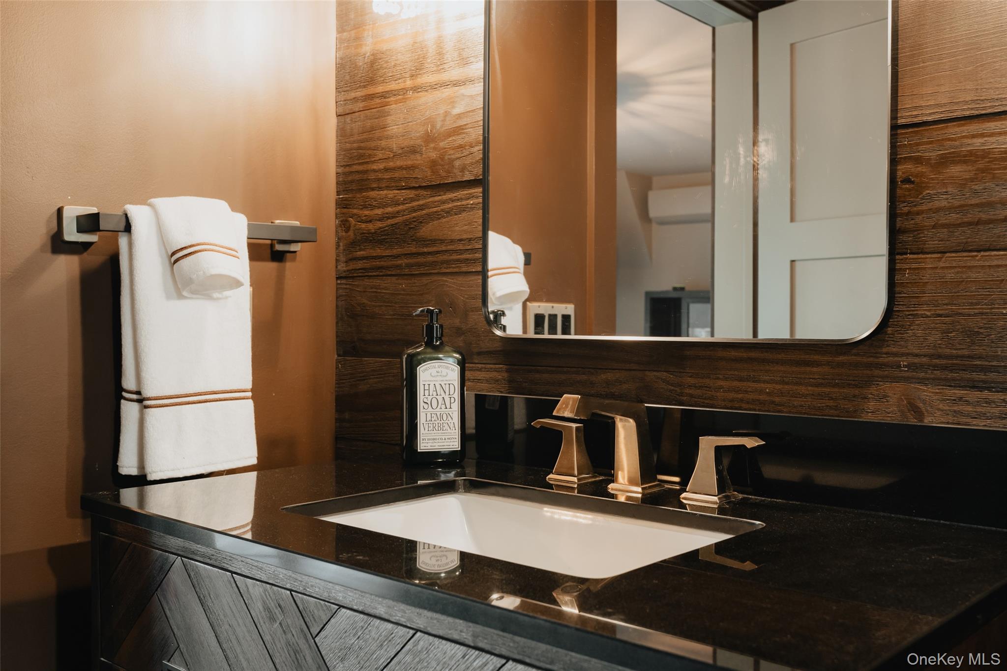 521 Perry Road Swan Lake, NY 12783 - Photo 22 of 32 a bathroom with a sink and a mirror