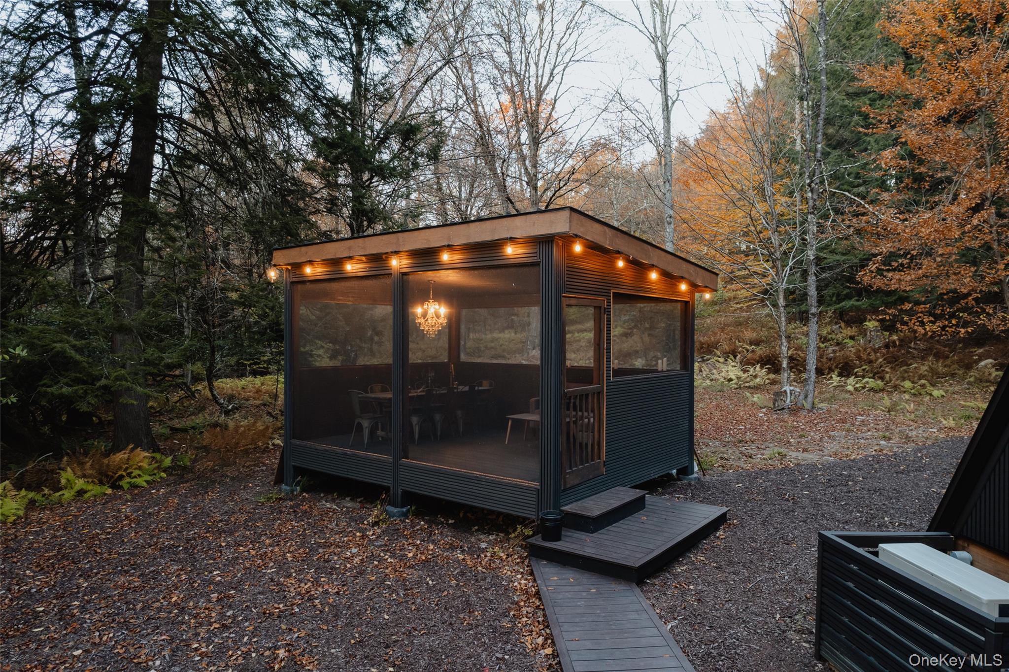 521 Perry Road Swan Lake, NY 12783 - Photo 28 of 32 a view of a wooden bench sitting in the middle of a yard