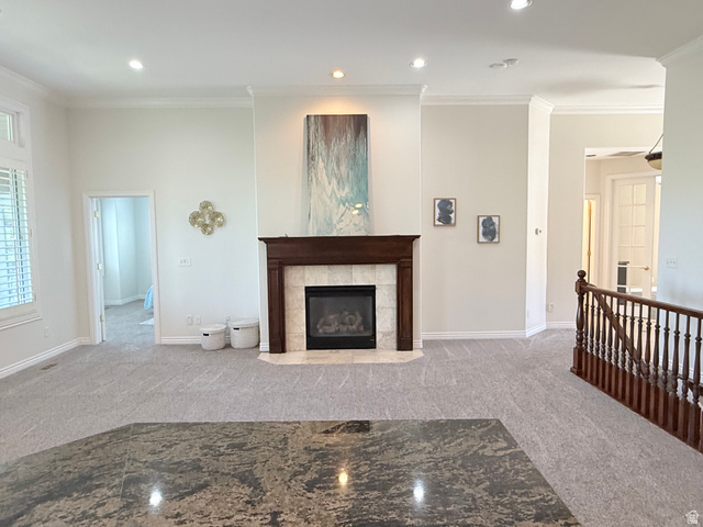1562 Fairway Ridge Road Draper, UT 84020 - Photo 7 of 60 Living area featuring a traditional fireplace with wood mantel and tile surround, recessed lighting, crown molding, and light gray patterned carpet