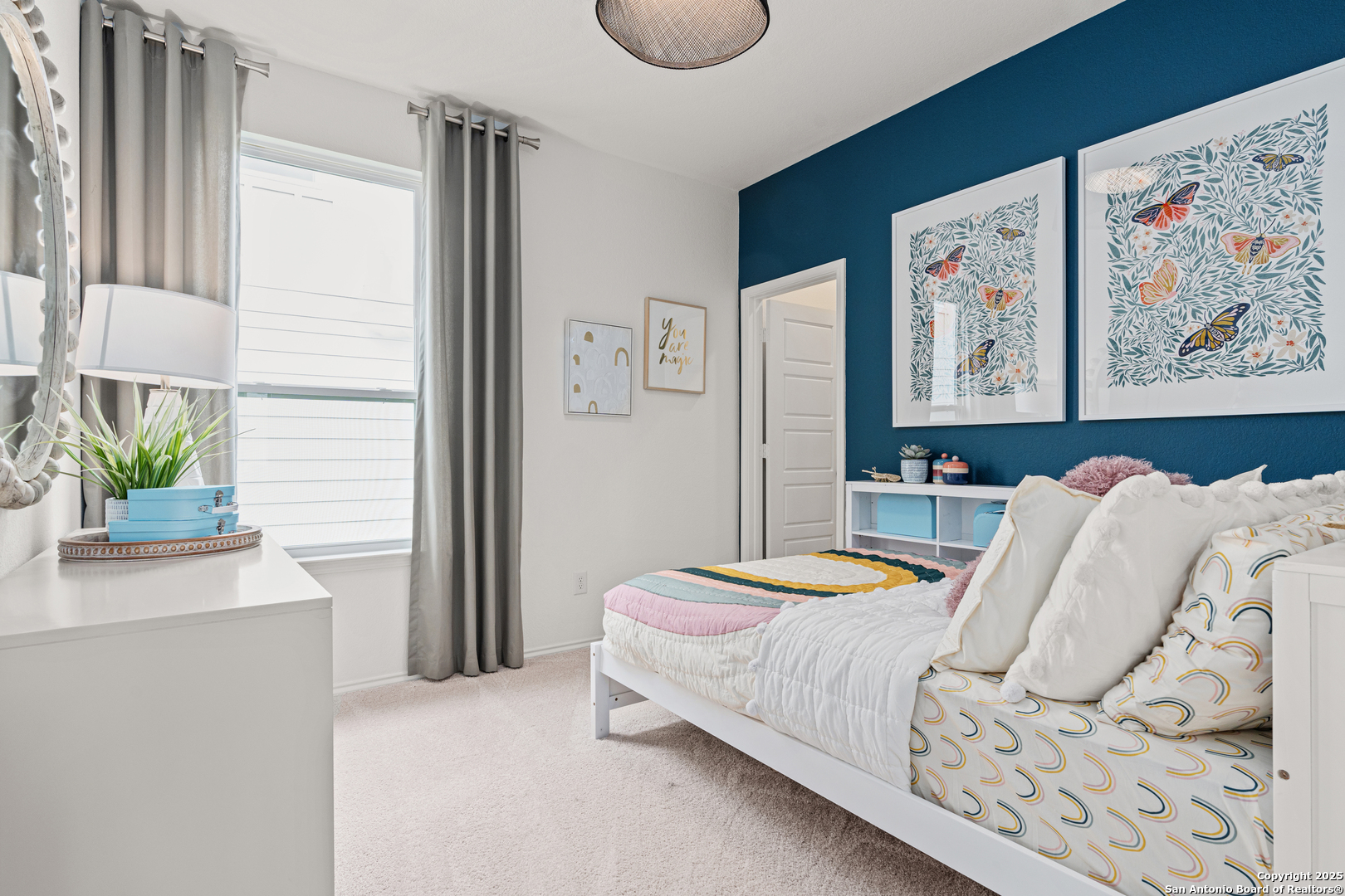 405 Raven Row Marion, TX 78124 - Photo 21 of 25 a bedroom with a bed and a window