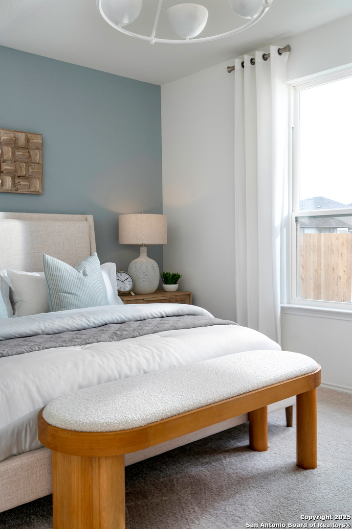 405 Raven Row Marion, TX 78124 - Photo 22 of 25 a bedroom with bed and window