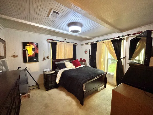 a bed room with a bed and a window