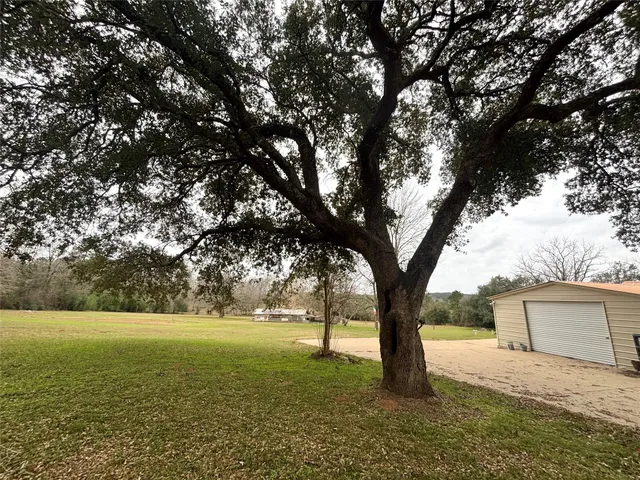 a view of outdoor space with deck and a yard