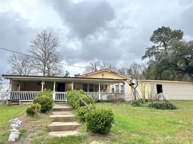 a view of a lake with a yard