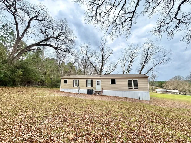a view of a work space with furniture and wooden floor
